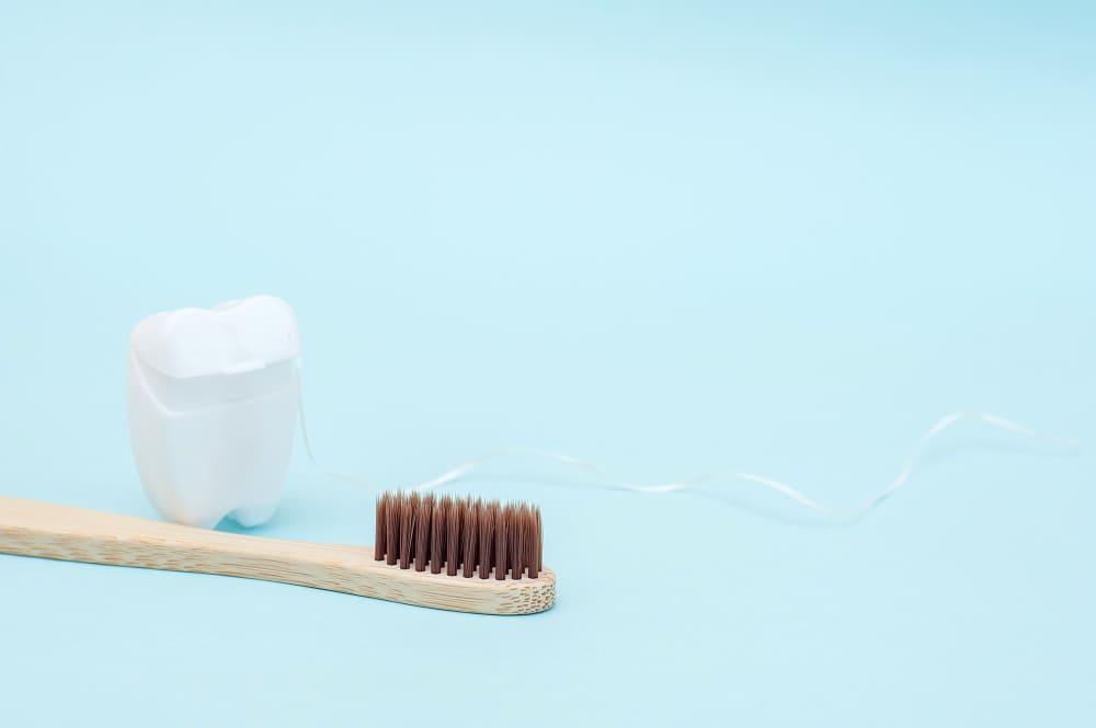 Dental floss and toothbrush