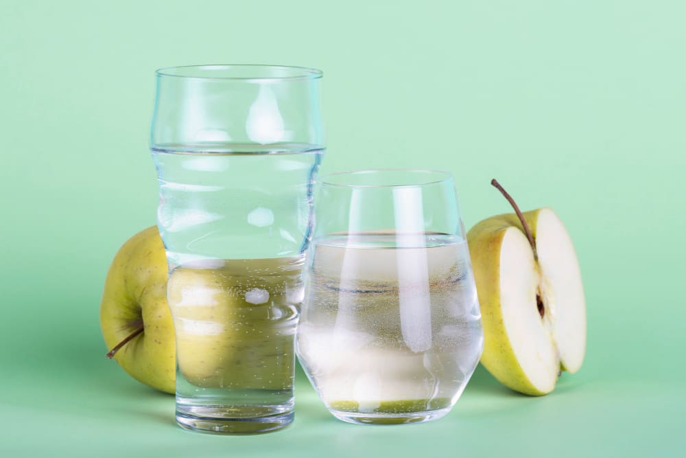 Glass of water and healthy snacks
